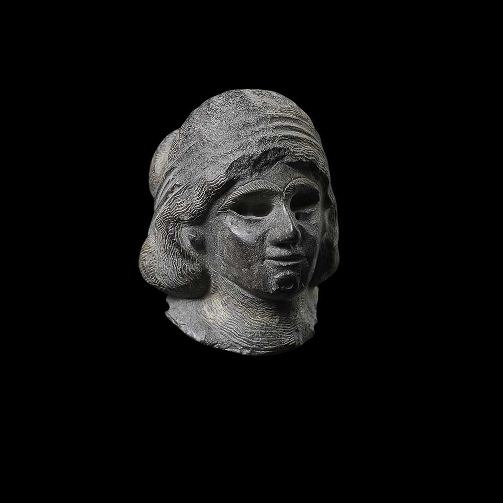 MESOPOTAMIAN HEAD OF A FEMALE WORSHIPPER
WESTERN