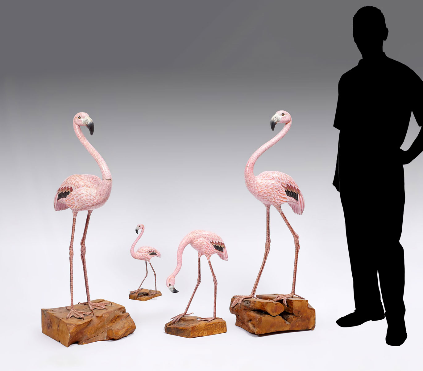 4 CARVED WOOD FLAMINGOS: 4 hand