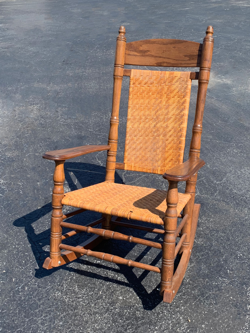 BRUMBY CANED PORCH ROCKING CHAIR: