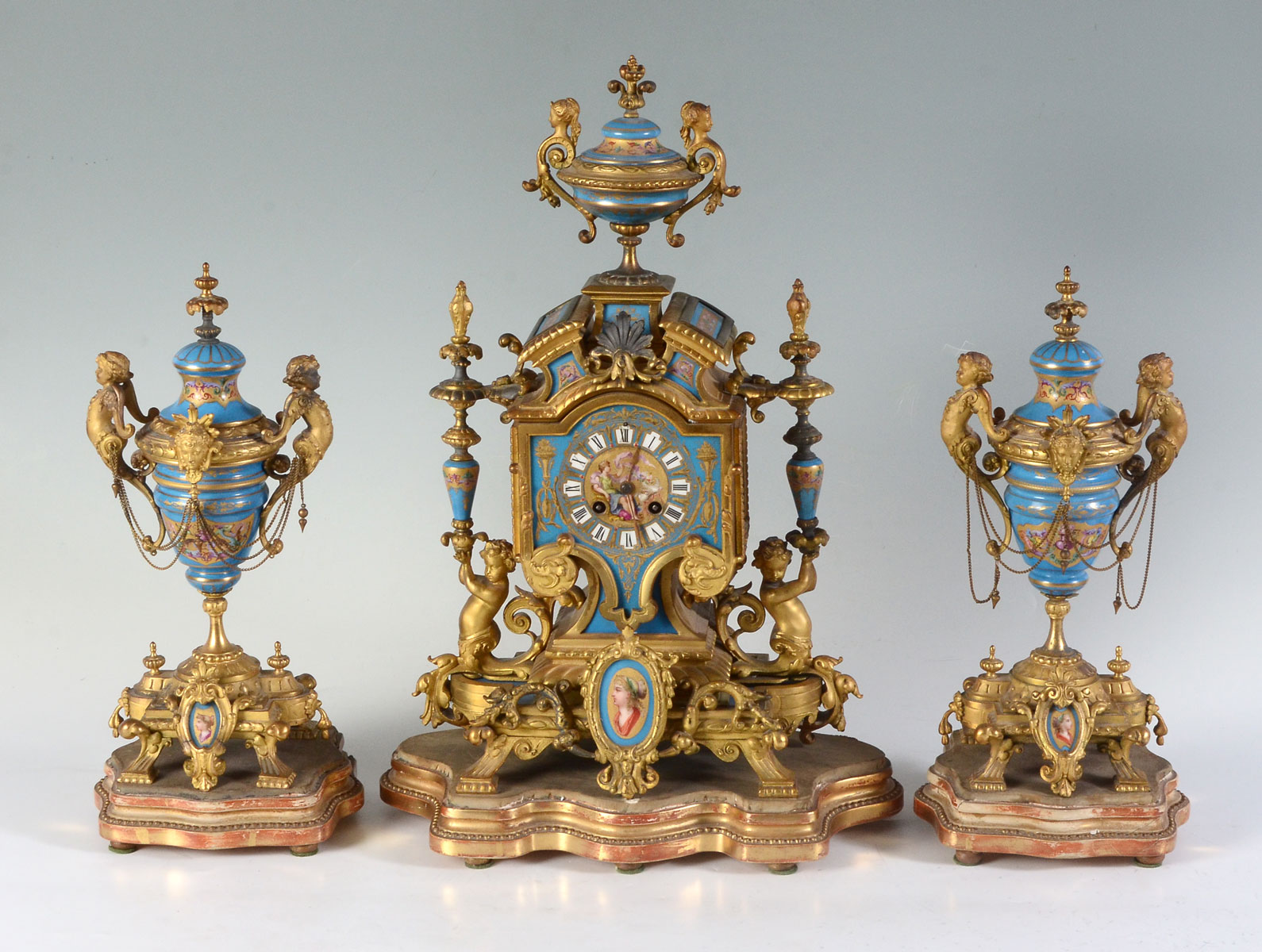 BRONZE AND PORCELAIN FRENCH CLOCK GARNITURE: