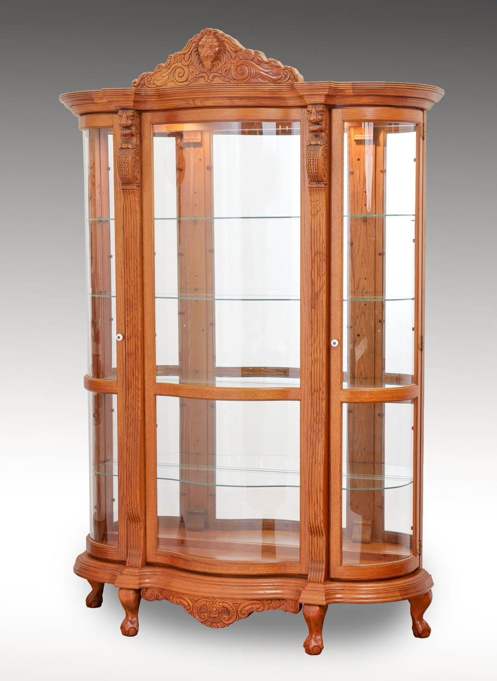 CARVED OAK TRIPLE BOW CURIO CABINET: