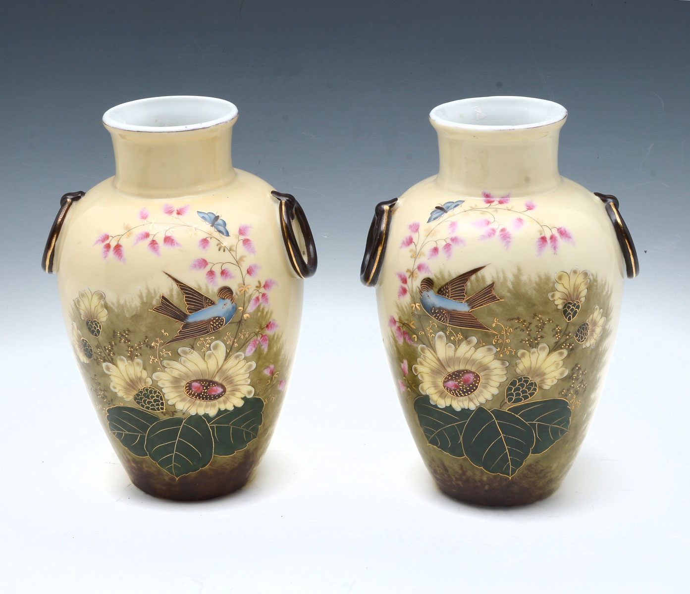 PAIR OF PAINTED OPPOSING PORCELAIN