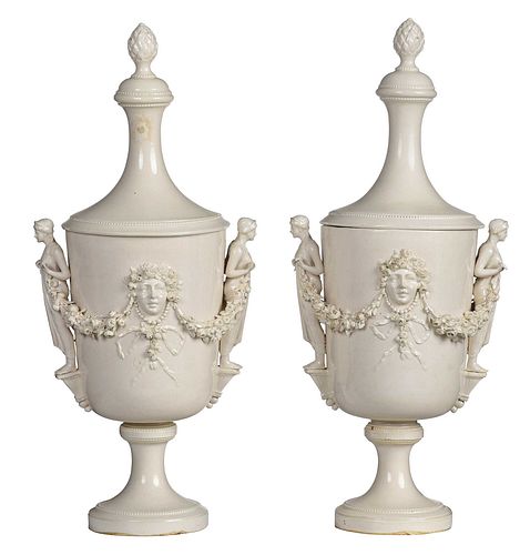 PAIR OF SOFT PASTE LIDDED URNSFrench,
