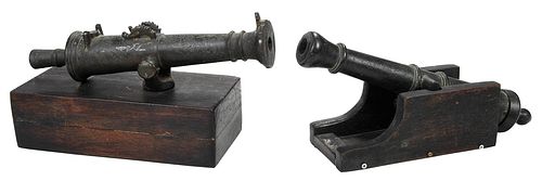 TWO MINIATURE BRONZE CANNONS ON