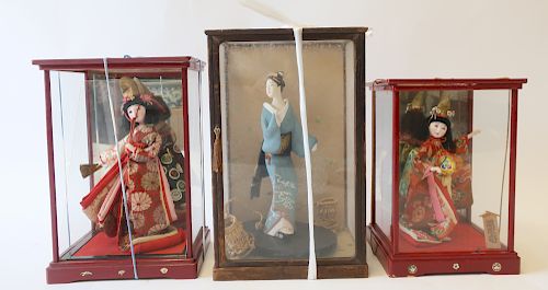 3 JAPANESE DOLLSIn glass cases.