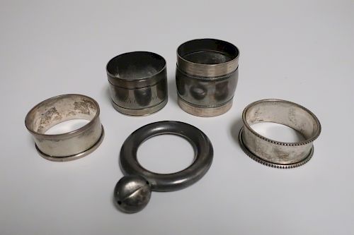 4 SILVER NAPKIN RINGS AND A TIFFANY