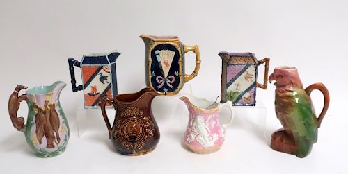 7 MAJOLICA POTTERY PITCHERS  373550