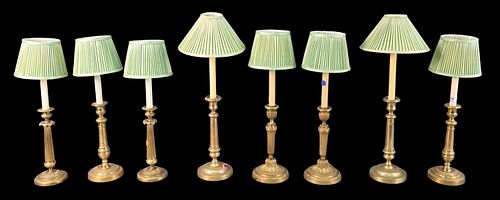 FOUR PAIRS OF BRASS CANDLESTICKSFour