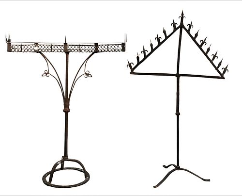 TWO GOTHIC WROUGHT IRON FLOOR CANDELABRUMSTwo 375a5e