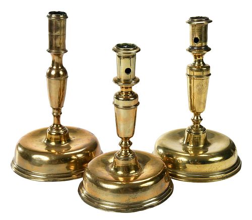 THREE NORTHERN EUROPEAN BRASS CANDLESTICKSprobably