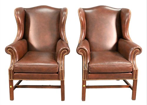 A PAIR OF LEATHER UPHOLSTERED WING 375e23