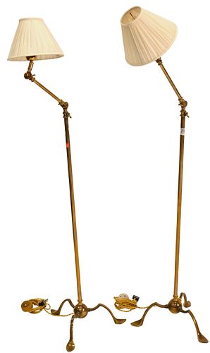 A PAIR OF BRASS ARTICULATING FLOOR 374aef