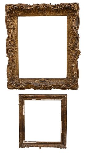 TWO HEAVILY CARVED GILT FRAMES,