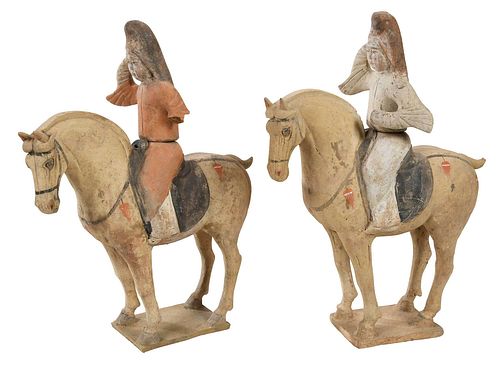 PAIR OF CHINESE POTTERY EQUESTRIAN FIGURINESWestern