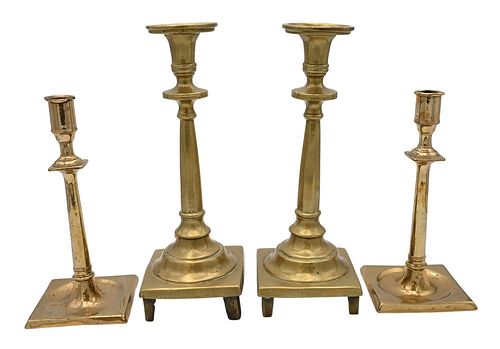 TWO PAIRS OF EARLY BRASS CANDLESTICKS,