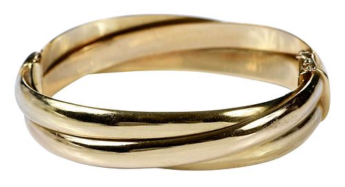 18KT. BRACELEThinged bangle, stamped