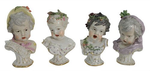 SET OF FOUR PORCELAIN BABY BUSTS