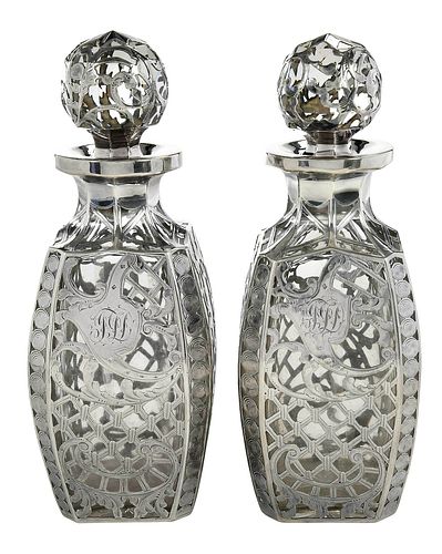 PAIR OF SILVER OVERLAY GLASS DECANTERSprobably