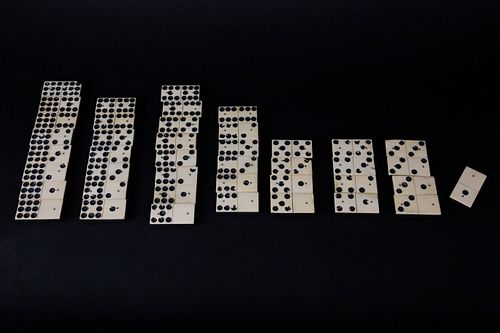 COLLECTION OF 42 BONE AND EBONY DOMINOS,