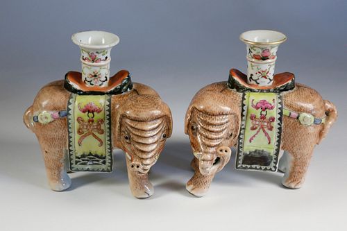 PAIR OF FAMILLE ROSE ELEPHANT CANDLESTICKS,