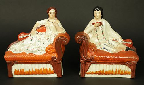 PAIR OF STAFFORDSHIRE FIGURES RECLINING