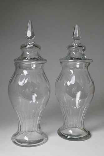 PAIR OF CLEAR GLASS COVERED URNS,