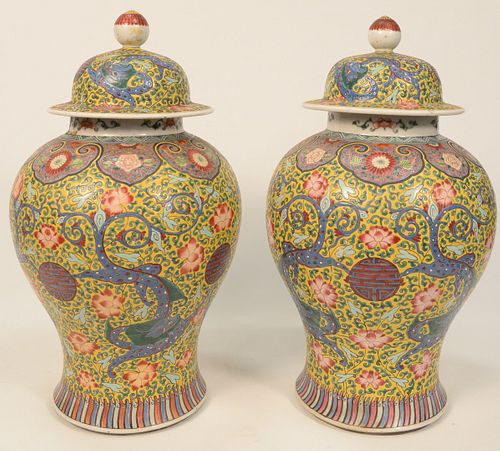 PAIR OF FAMILLE VERTE COVERED JARS