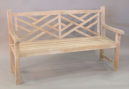 TEAK BENCH WITH GEOMETRIC BACK.