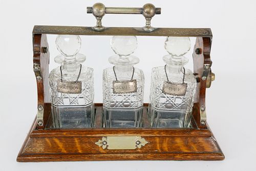 ENGLISH OAK AND CRYSTAL THREE-BOTTLE