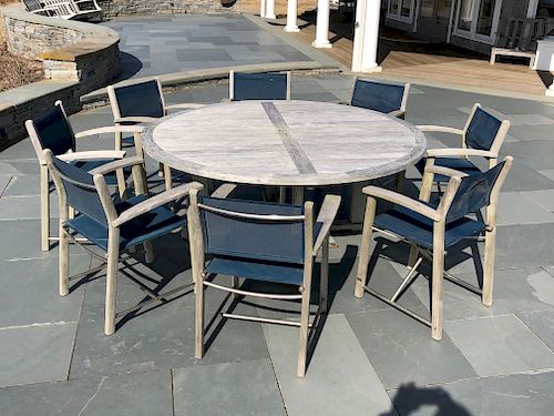 ROUND TEAK DINING TABLE AND 8 ASSEMBLED