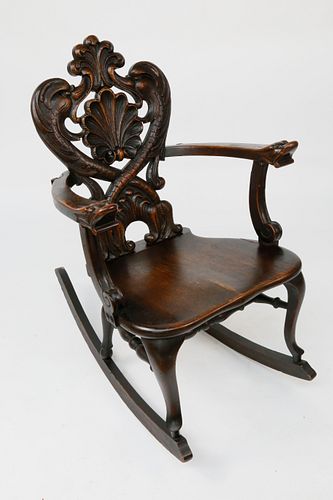 ANTIQUE CARVED SOLID OAK ROCKING CHAIR,