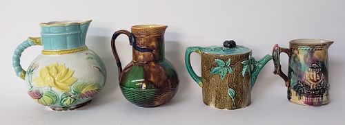 FOUR ANTIQUE MAJOLICA PITCHERS