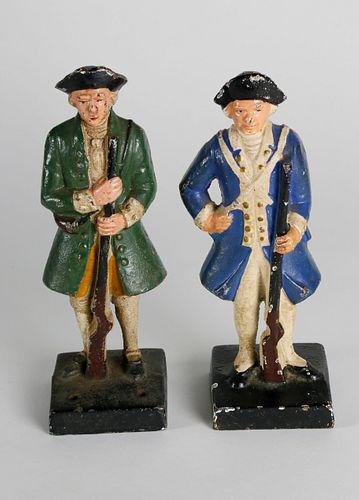 TWO CAST IRON HAND PAINTED COLONIAL