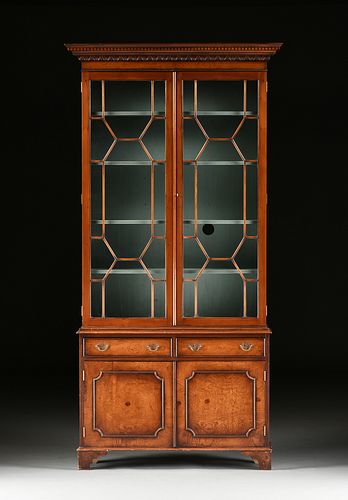 A GEORGE III STYLE CARVED ELM BOOKCASE 381095