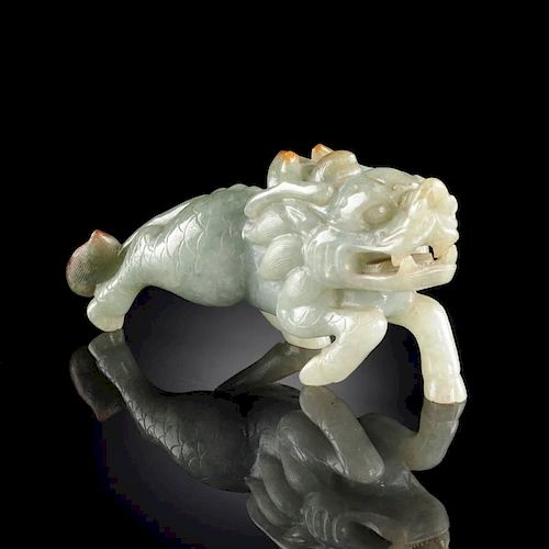 A CHINESE CARVED CELADON JADE FIGURE