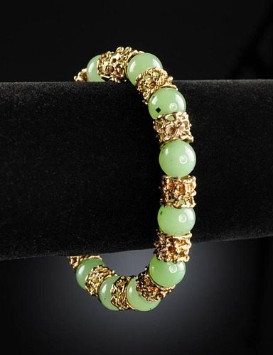 A 14K YELLOW GOLD AND GREEN JADE