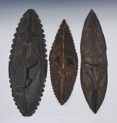 THREE NEW GUINEA WOODEN MASKSThree