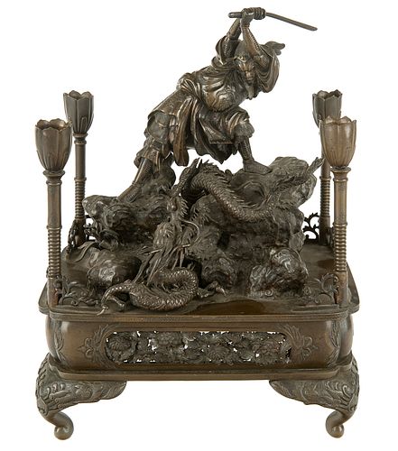 A JAPANESE BRONZE CANDLE STAND,