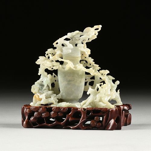 A CHINESE CELADON JADE COVERED