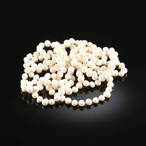 A ROPE OF CREAM WHITE BAROQUE PEARLS