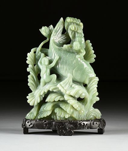 A LARGE CHINESE CARVED CELADON JADE