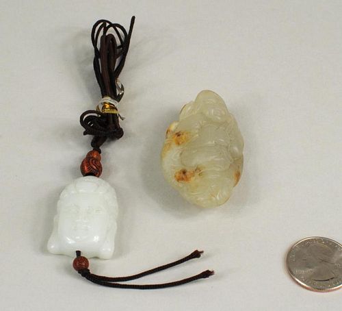 TWO CARVED CHINESE JADE PENDANTSTwo