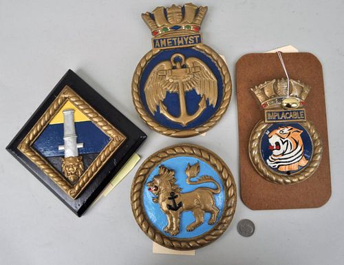 FOUR PAINTED METAL SHIP'S BADGESfor