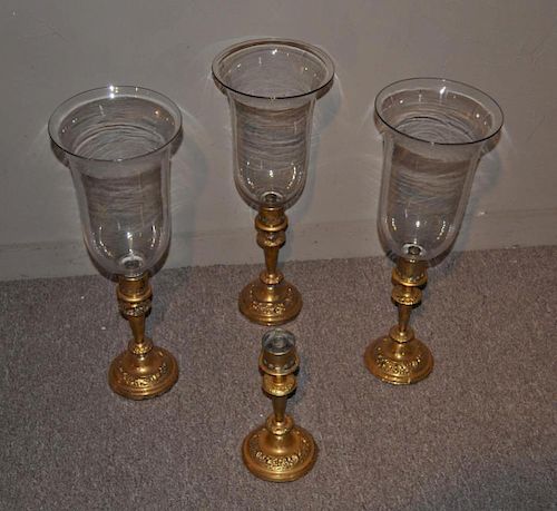 GROUP FOUR BRASS WEIGHTED CANDLESTICK 38311b