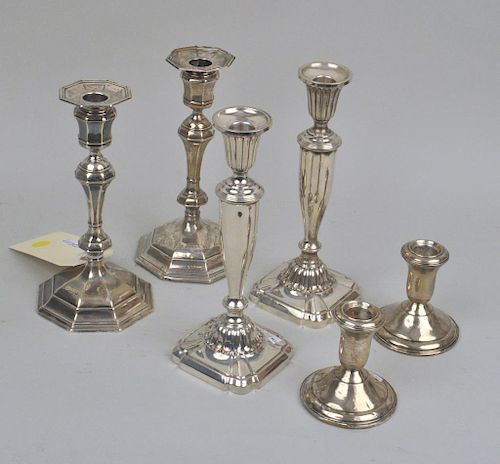 THREE PAIR WEIGHTED STERLING CANDLESTICKScomprising