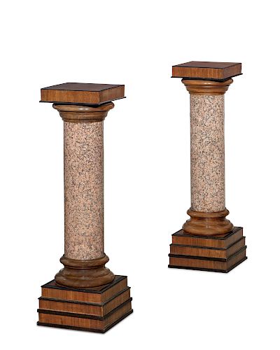 A PAIR OF GRANITE AND WALNUT PEDESTALSA