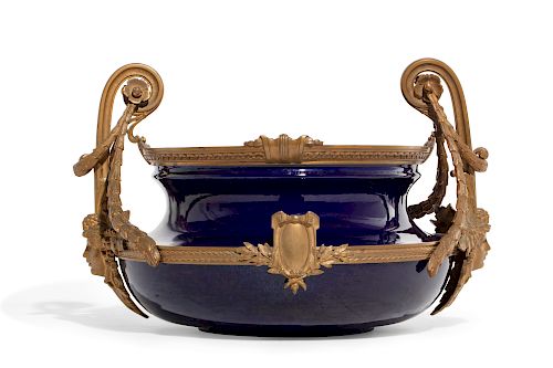 A FRENCH BRONZE AND BLUE EARTHENWARE