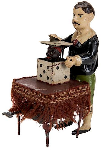 ANTIQUE WIND-UP MAGICIAN TOY.Antique