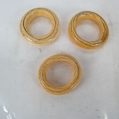 THREE POLISHED BONE BANGLESThree 3885b1