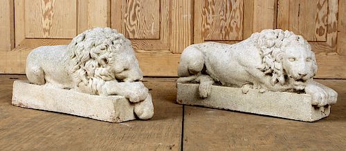 A PETITE PAIR OF CAST STONE LIONSA